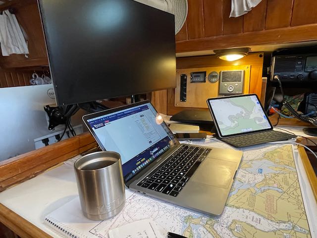 computer and monitor setup working remotely on a boat