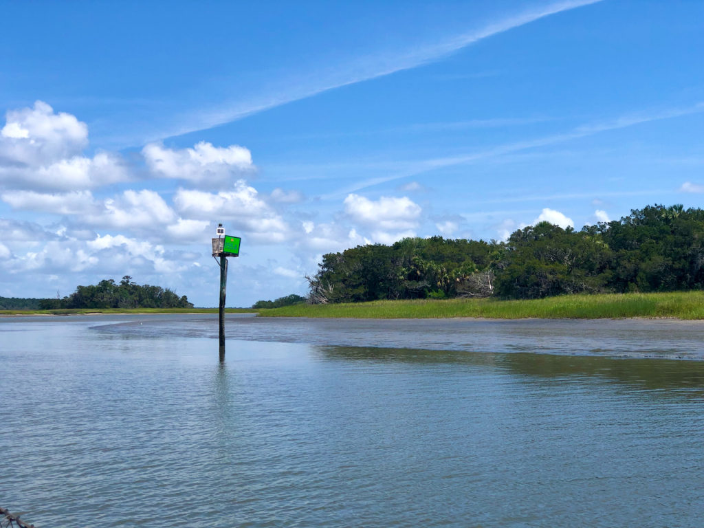 Green Channel Marker on the Intracoastal Waterway with shallow water